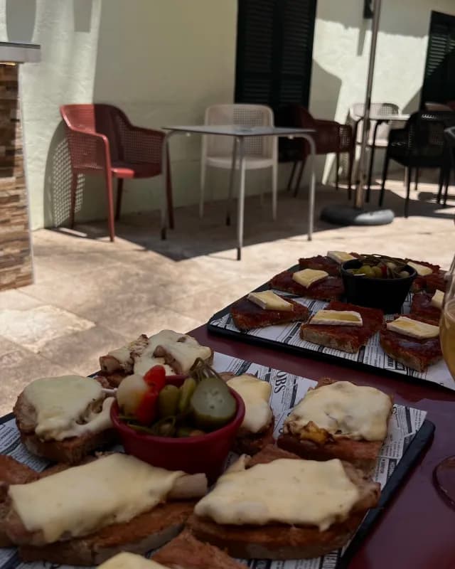Pan con tomate tapas spread at a Mallorca terrace restaurant